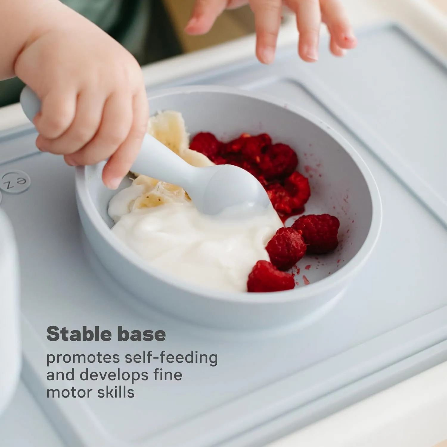 ezpz Mini Bowl for 12 Months  (Coral) - 100% Silicone Suction Bowl with Built-in Placemat for Toddlers - Comes with a Reusable Travel Bag